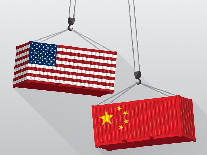 Geopolitamerical flag and chinese flag representing Geopolitical Risks for the Economy